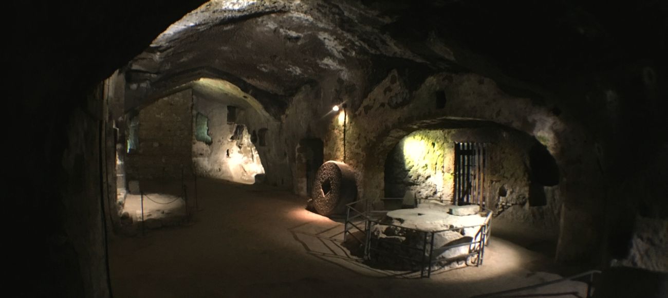 orvieto underground cellars made in sandstone. visit orvieto on a transfer tour from florence to naples and amalfi coast or positano
